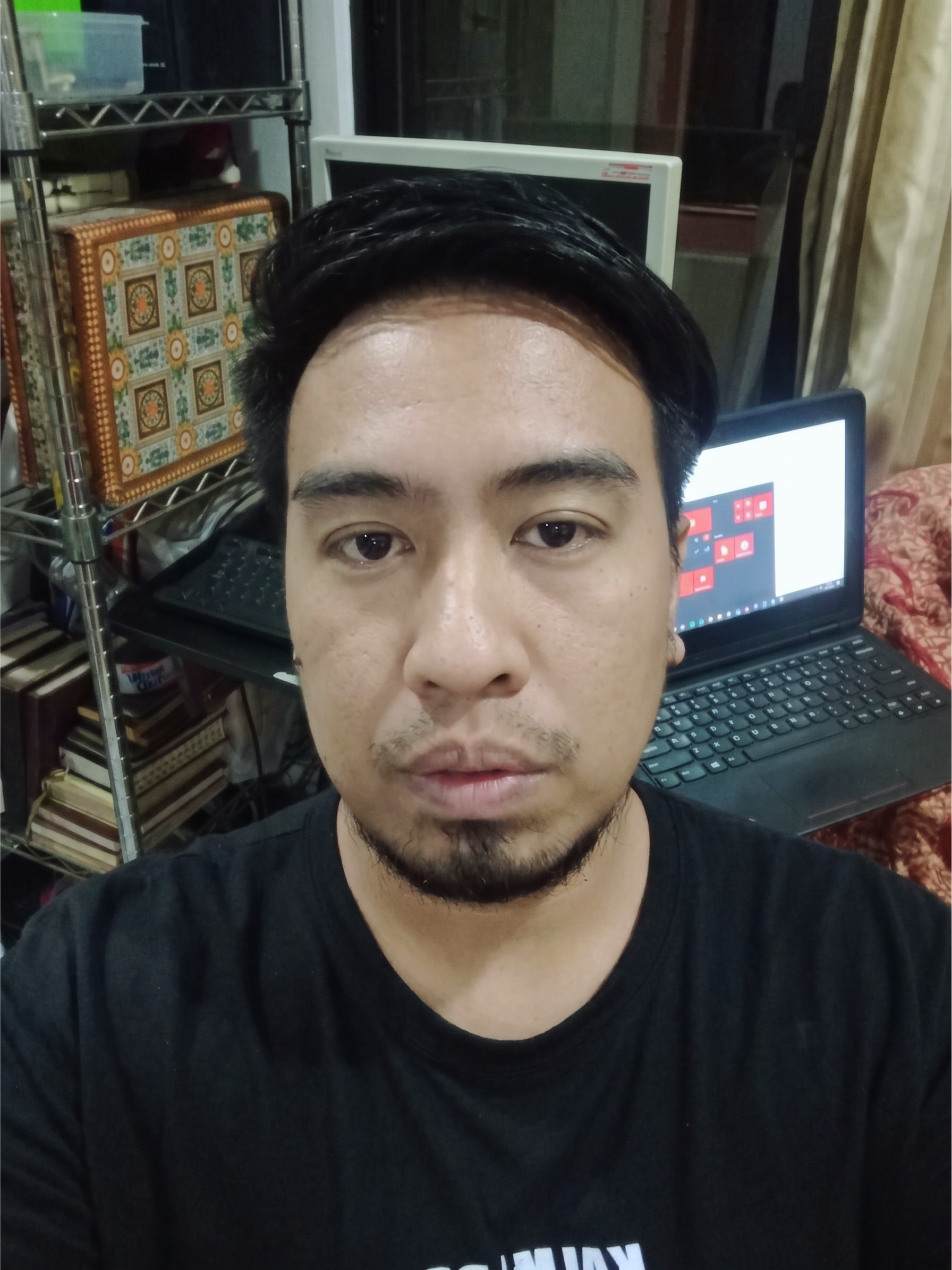 Portrait of Lawrence Anthony Tan Juntilla in his workspace.